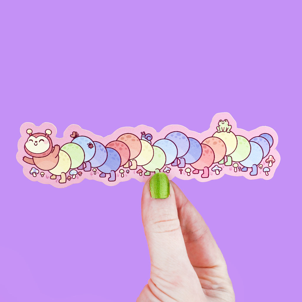 Long Bookmark shaped like a caterpillar that has rainbow colors and tiny bugs