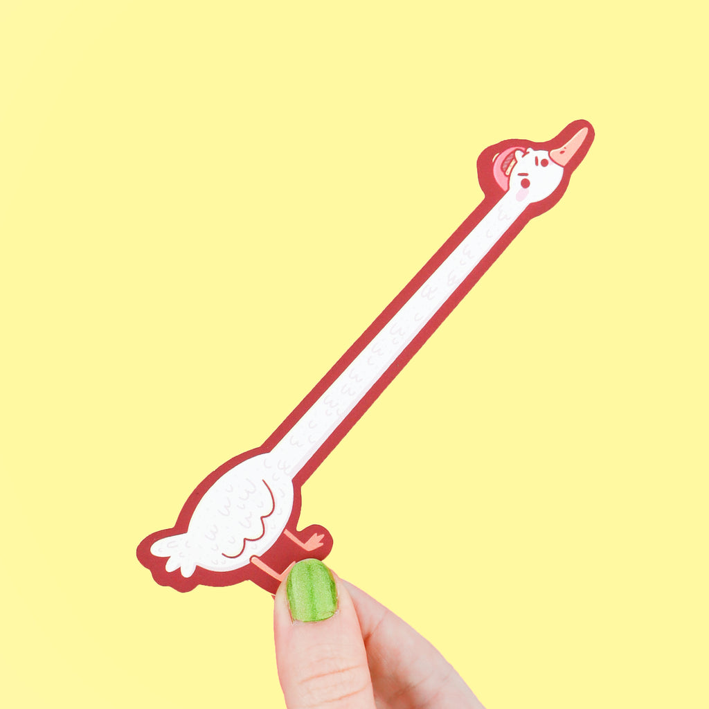 Long bookmark shaped like a white goose with a long neck wearing a baseball hat