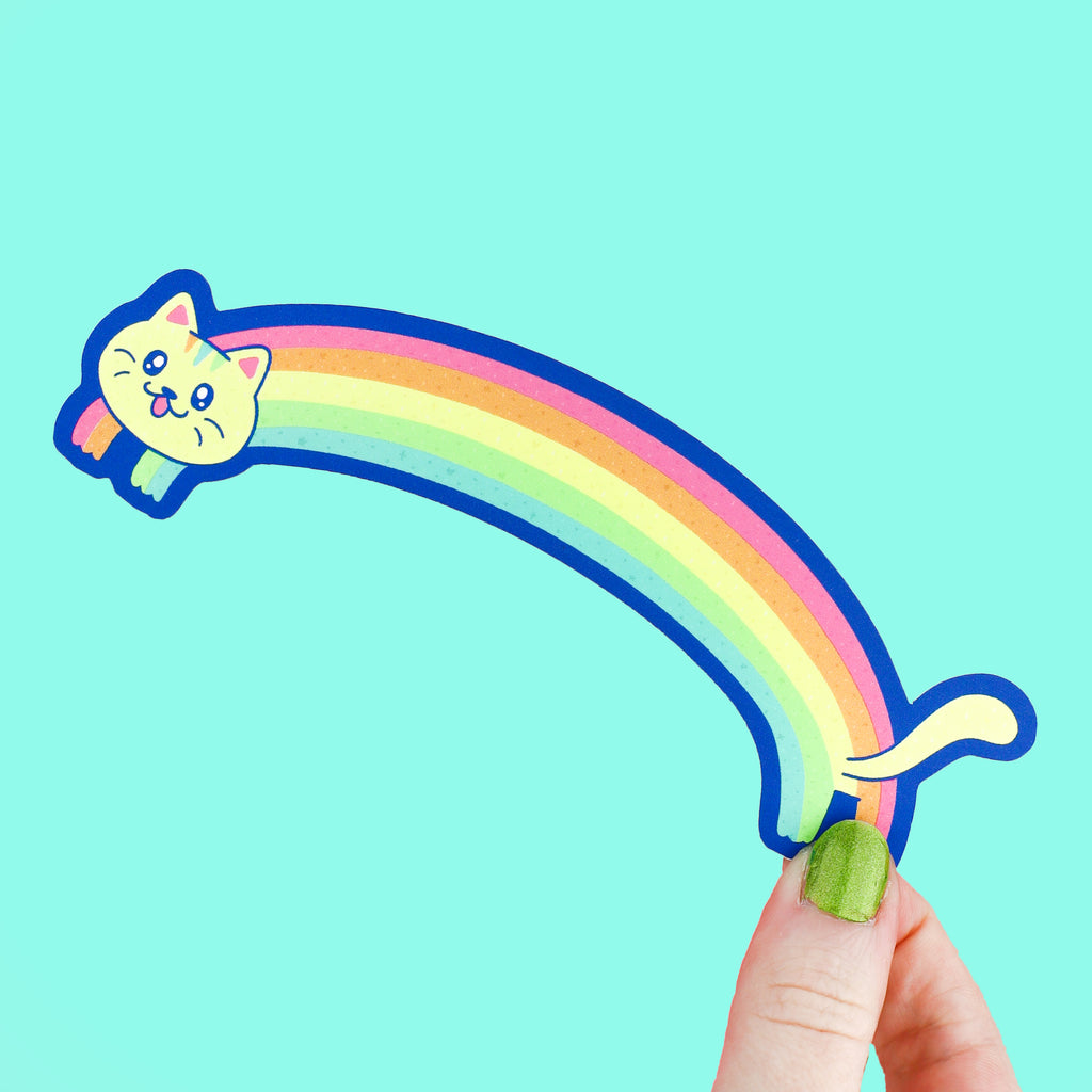Bookmark shaped like a cat that has a long colorful rainbow for its body