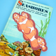 A vintage children's book titled "Seashores" by Golden, featuring a colorful underwater illustration with clownfish on the cover, photographed against a solid light blue background.