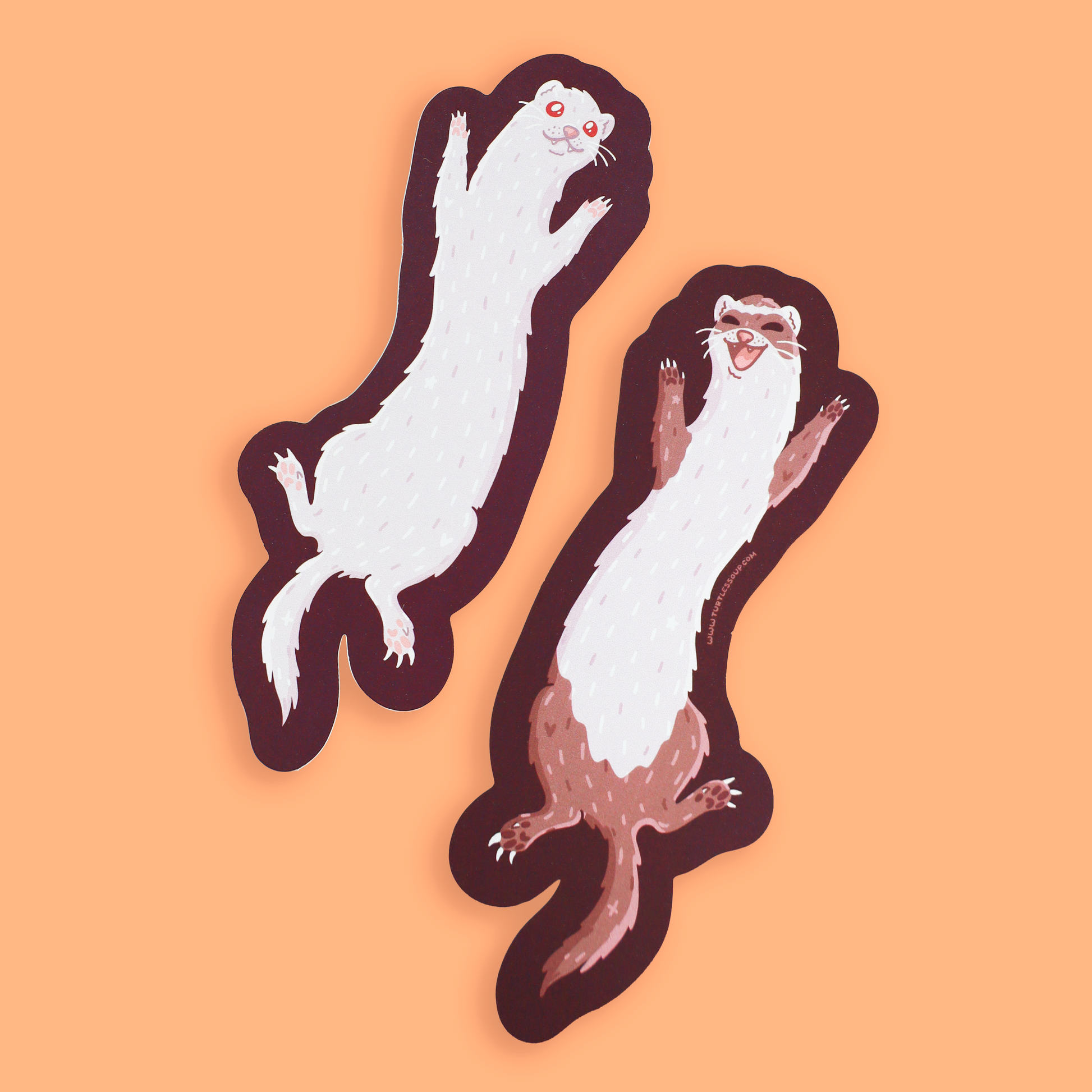 Two cartoon-style ferret stickers on an orange background. The stickers are white and brown with dark outlines, and one ferret is jumping upward while the other is standing with its paws raised.