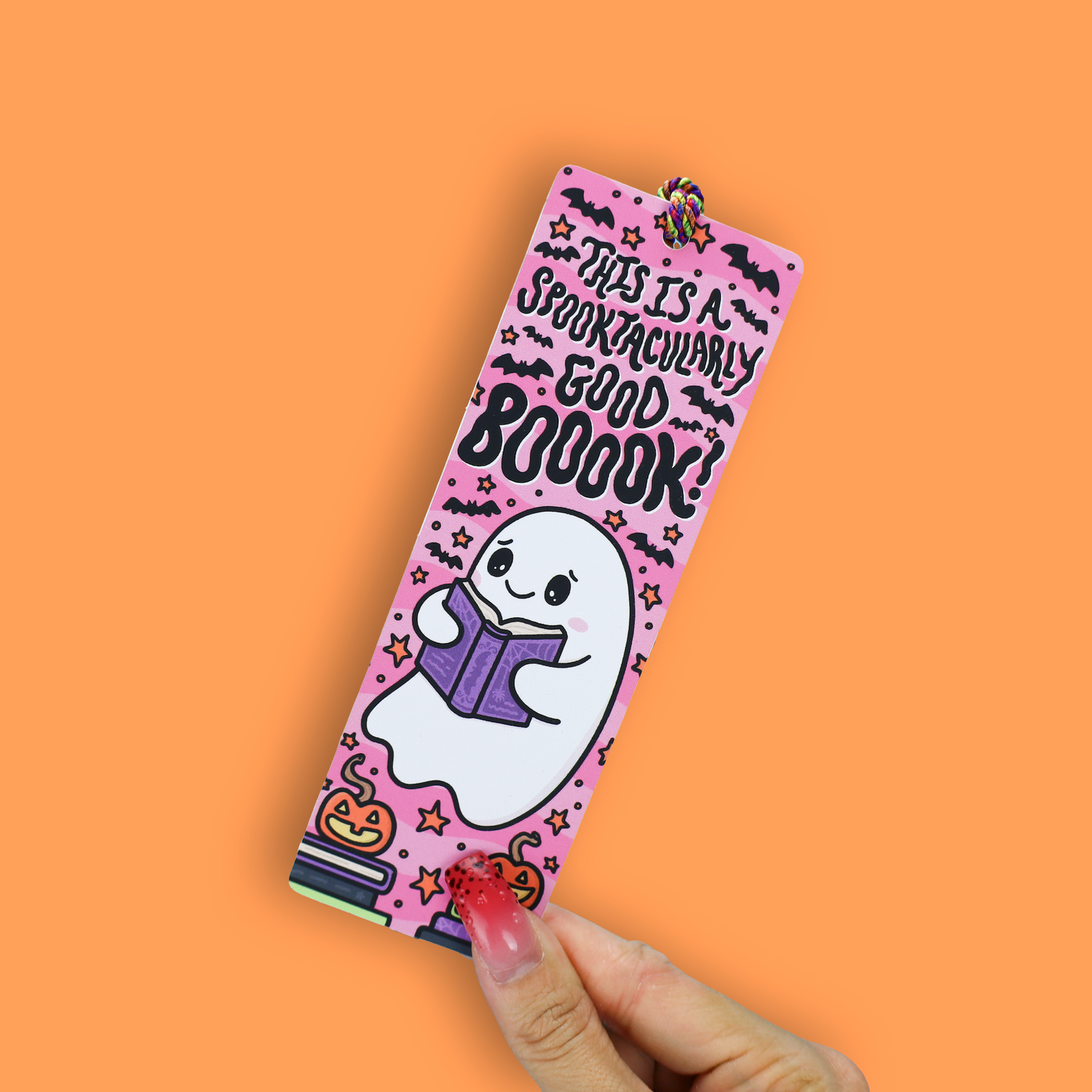 This is a Spooktacularly Good Boook Ghost Halloween Tasseled Bookmark