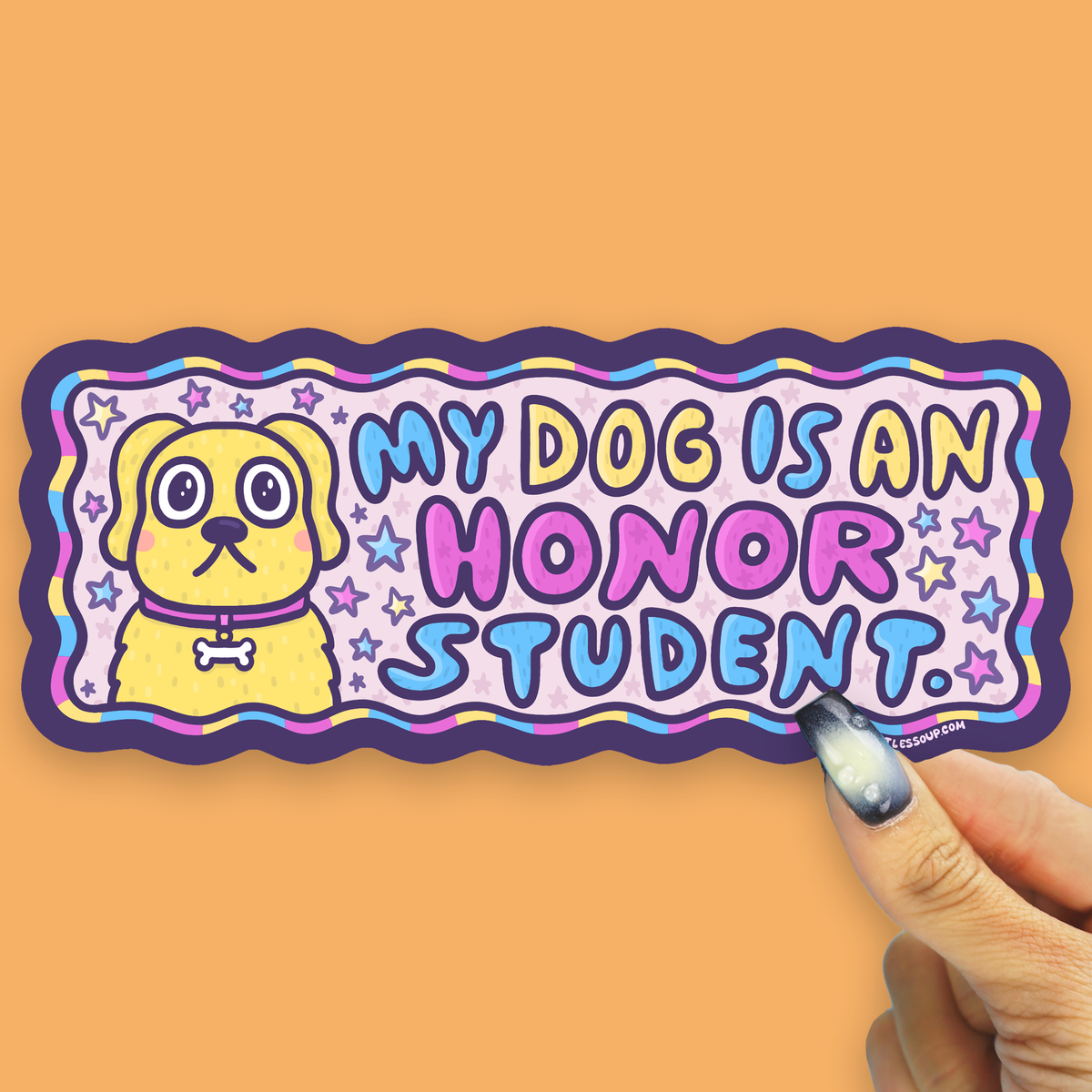 A die-cut sticker featuring a yellow cartoon dog and the text 'MY DOG IS AN HONOR STUDENT.' in colorful bubble letters, held by a hand against a solid orange background.