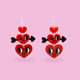 A pair of dangling heart earrings on a solid pink background. Each earring features three stacked red heart charms with black and white cartoon eyes and a small black heart-shaped arrowhead on the side.