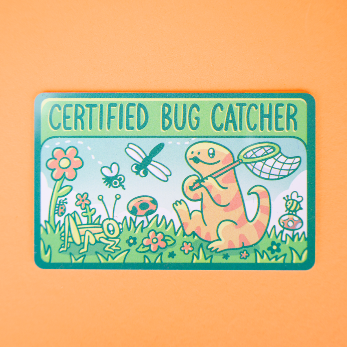 A rectangular sticker with rounded corners featuring a cartoon bug catcher design. The sticker has a green border and the text 'CERTIFIED BUG CATCHER' at the top.