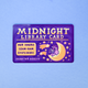 A rectangular purple card labeled 'MIDNIGHT LIBRARY CARD' with cream lettering, a yellow crescent moon and stars, and a small purple unicorn illustration, placed on a light blue background.