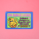 A rectangular novelty card or sticker with rounded corners featuring a cartoon yellow dog and the text 'DOG HANDLER LICENSE' and 'Official License to Handle and Wrangle DOGS' on a pink background.