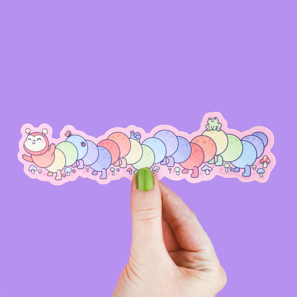 Long sticker shaped like a caterpillar that has rainbow colors and tiny bugs