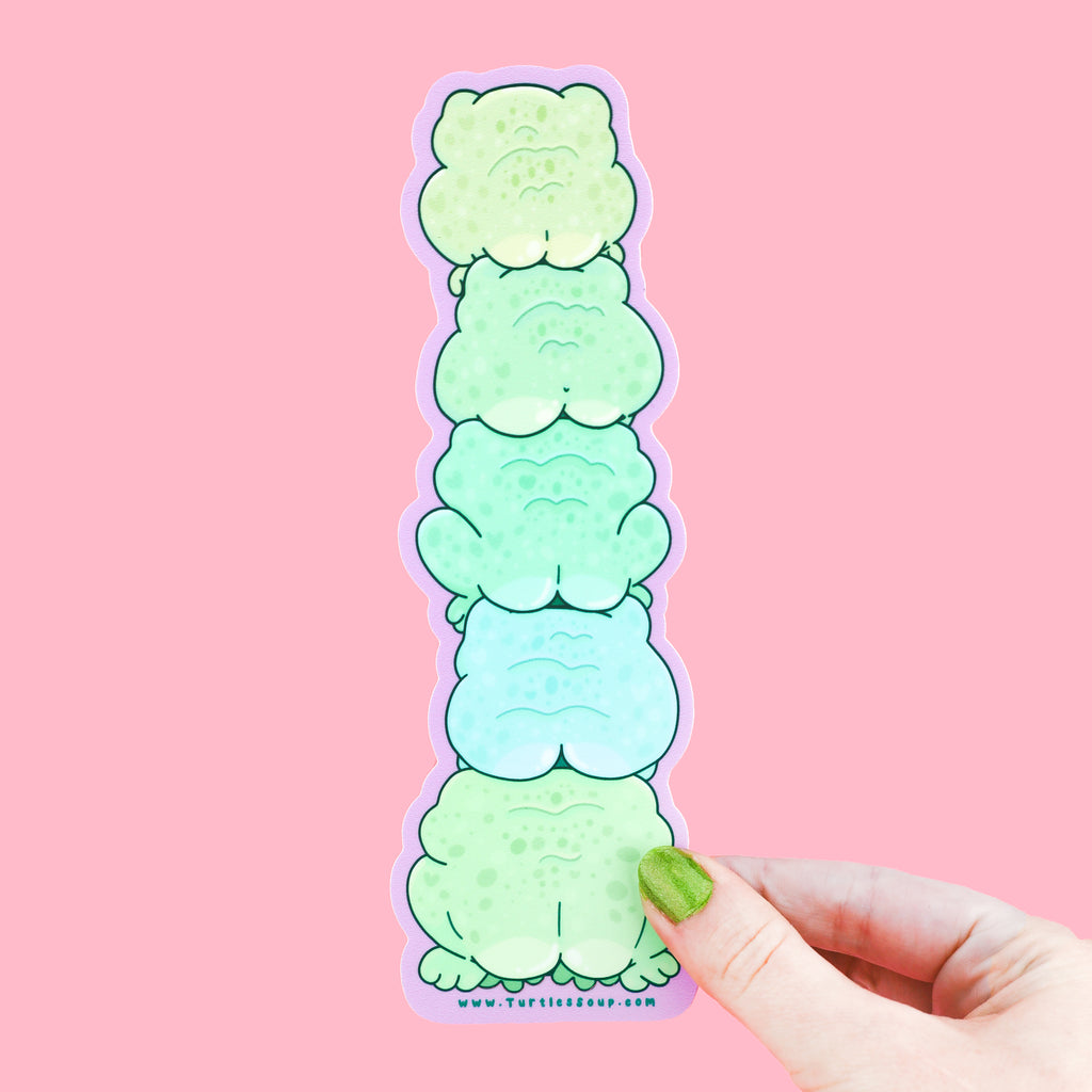 A sticker shaped like a stack of frogs with cute butts