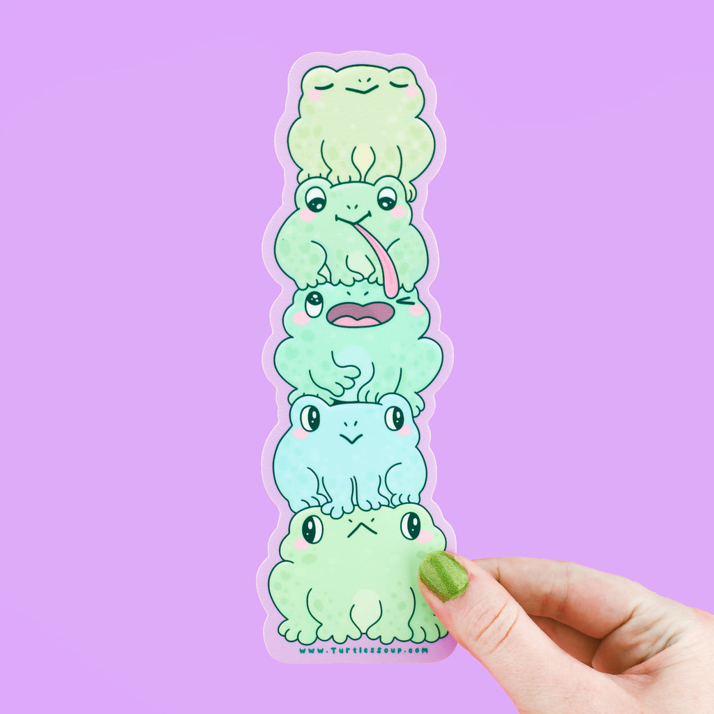 A sticker shaped like a stack of frogs with cute expressions