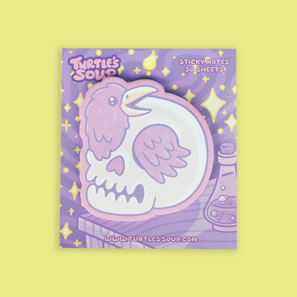 A package of Turtles Soup brand sticky notes, featuring a cute cartoon raven skull design in pastel purple and white on a lavender background with gold star accents.