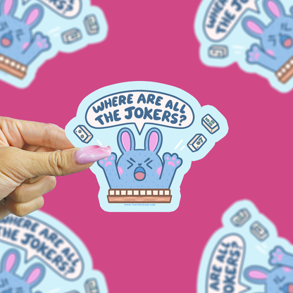 where are all the jokers bunny sticker being held up against a pink background