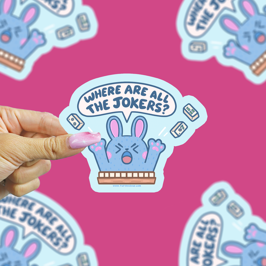 where are all the jokers bunny sticker being held up against a pink background
