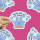 where are all the jokers bunny sticker being held up against a pink background