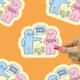 Nice rack mahjong sticker being held against a orange background
