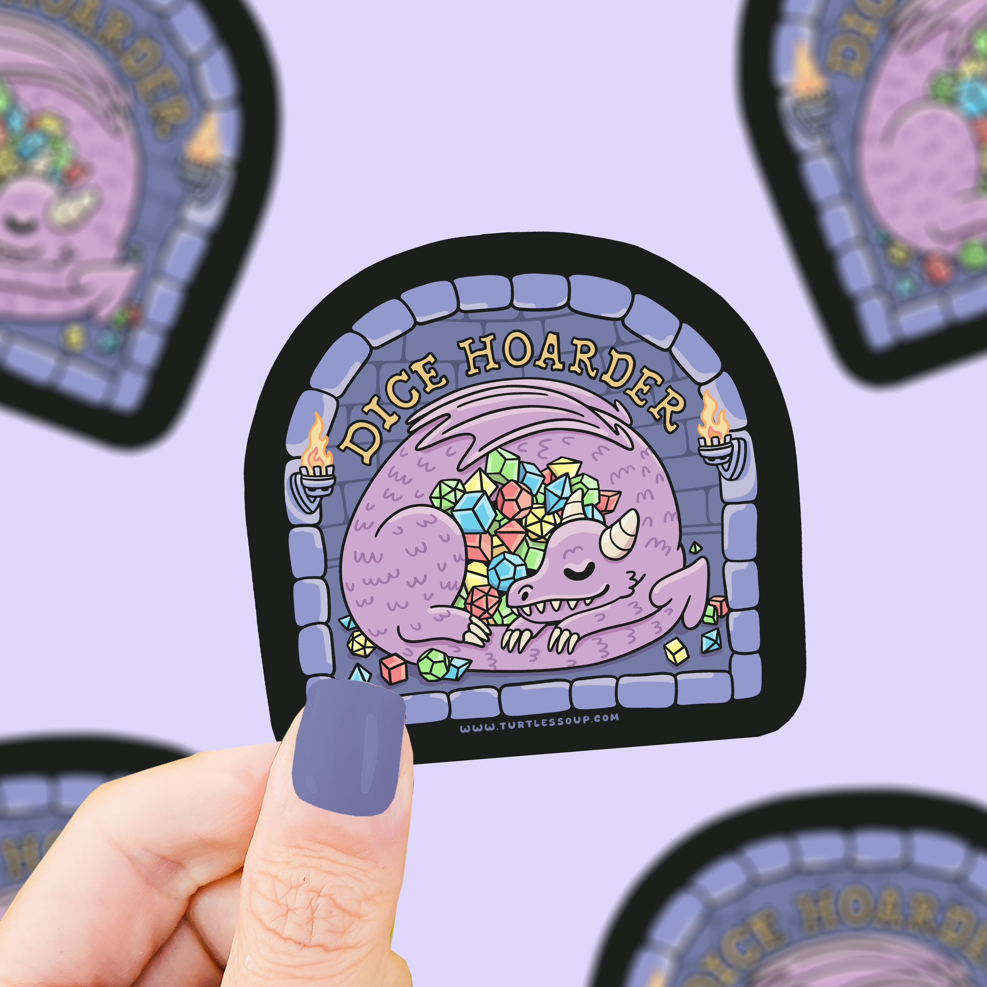 Sticker with a dragon illustration and 'Dice Hoarder' text held by a hand against a purple background with more stickers.