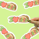 Sticker with 'I ❤️ TACOS' text on a green background