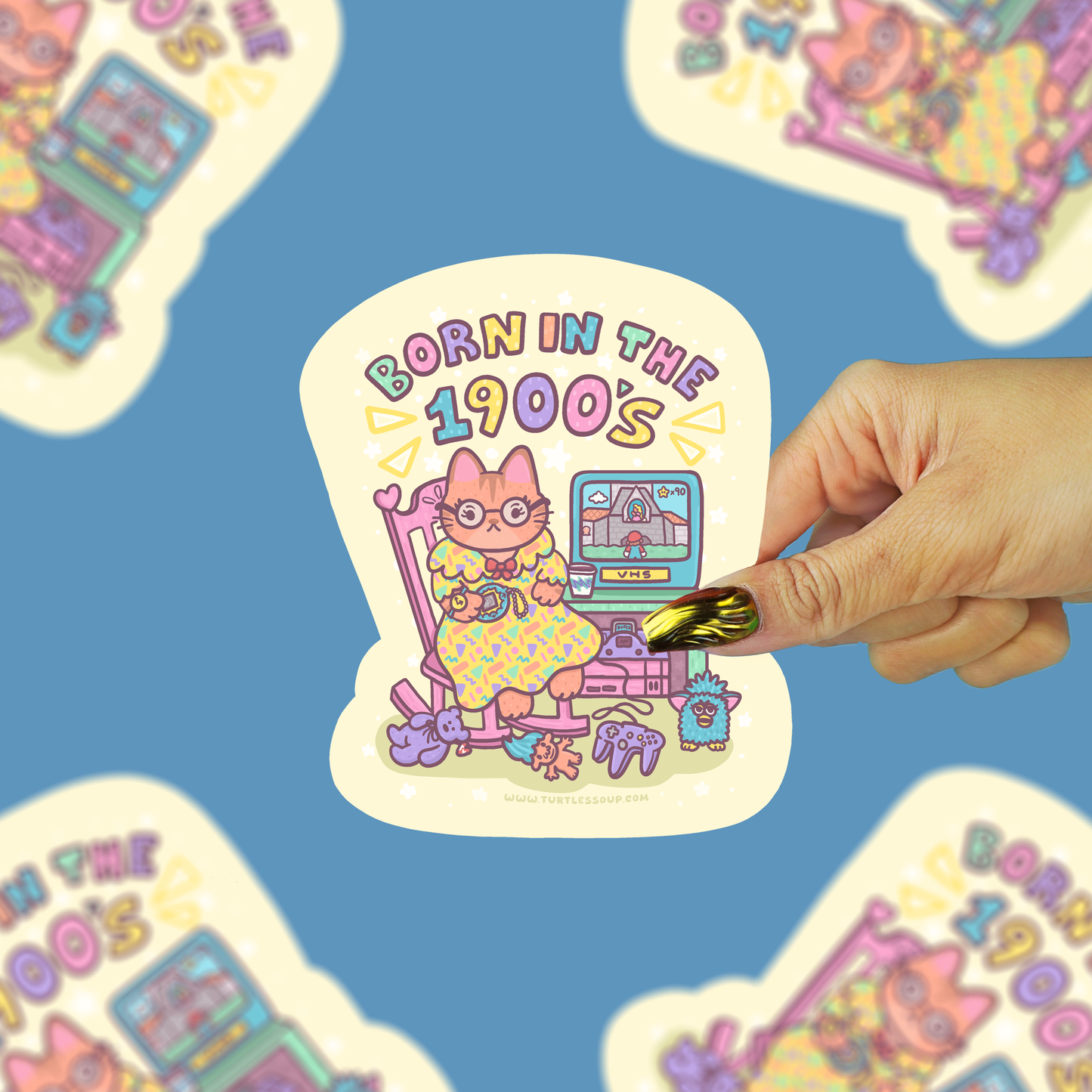 cat in a rocking chair surrounded by cute stuff from the 1990s being held against a blue background