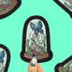 bird skull in globe terrarium with butterfly vinyl sticker
