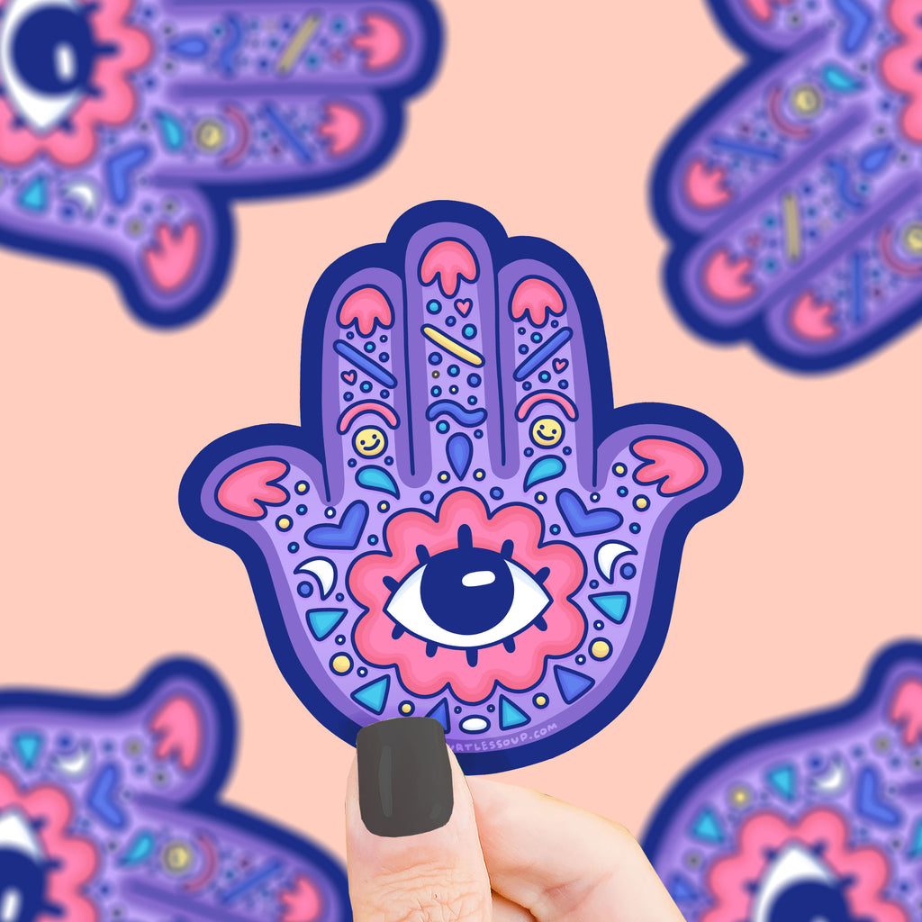 A hand shaped sticker with an eye in the palm, decorated with color and smile faces