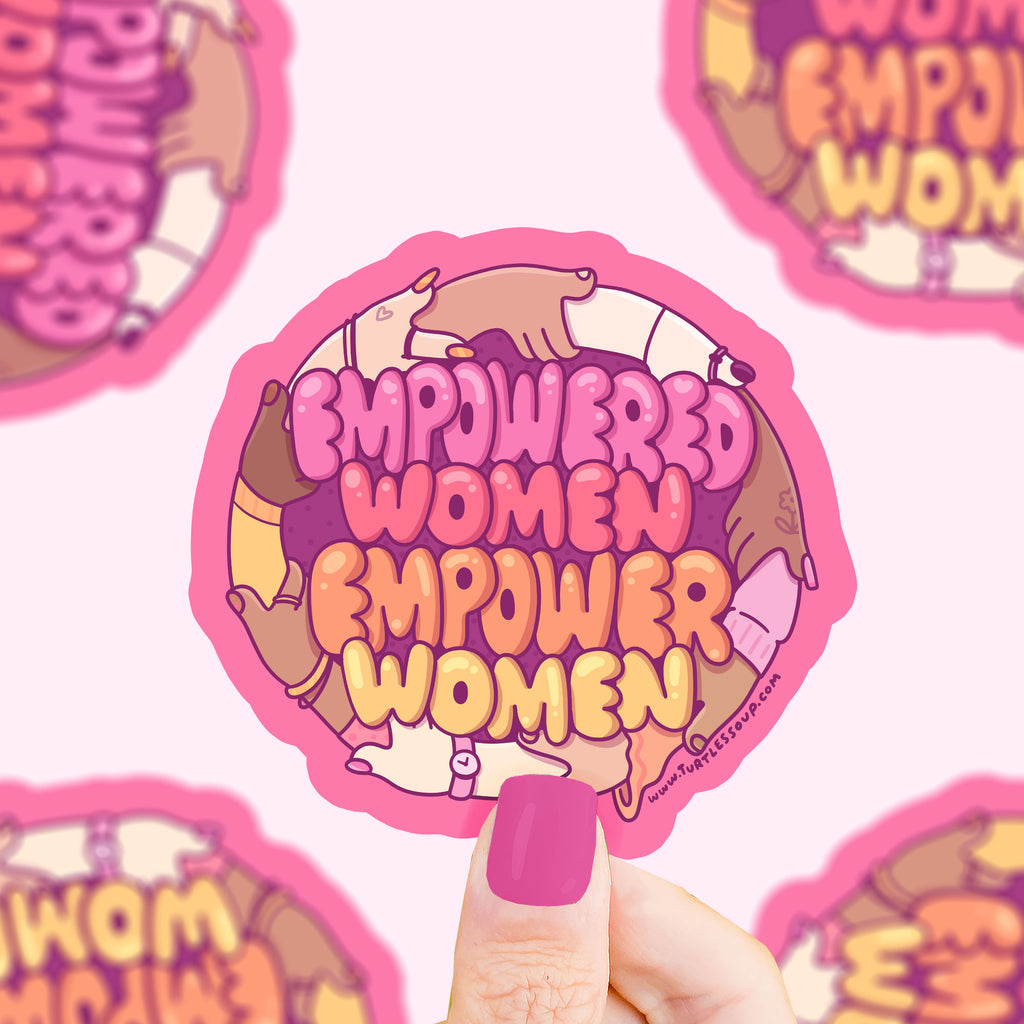 Text that says 'empowered women empower women' surrounded by a circle of women holding arms of many color skin