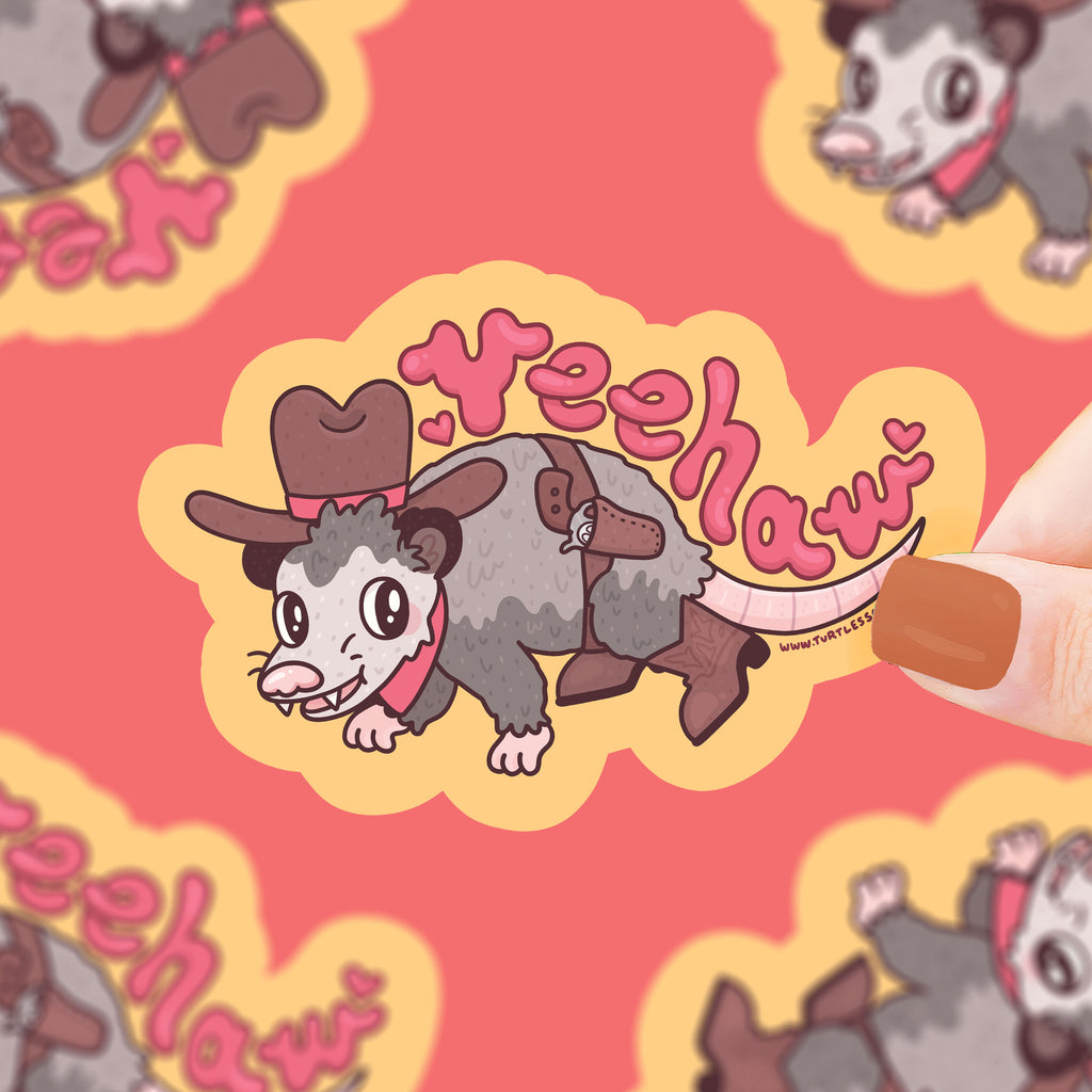 An opossum dressed like a cowboy with text that says "yee-haw"