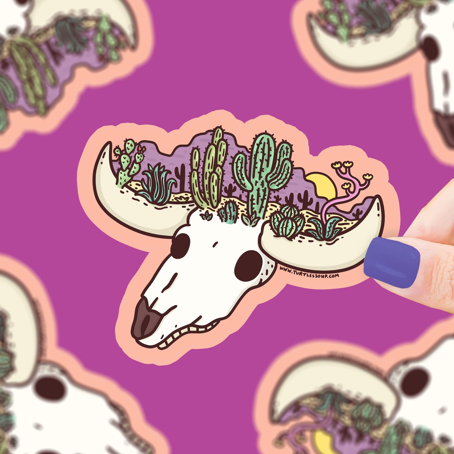 A cow skull head, atop it sits a desert landscape of cacti, plants, mountains, sun,and dirt