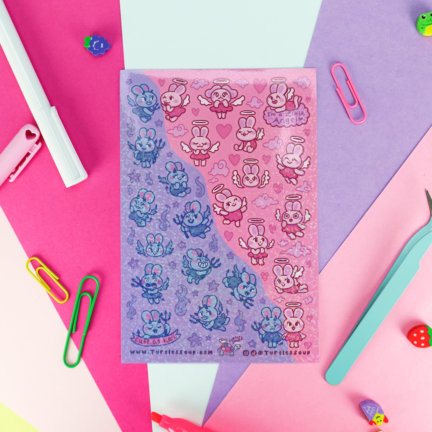 A sheet of cute cartoon bunny stickers with wings and hearts, split diagonally into blue on the left and pink on the right, styled on a colorful paper background with stationery props.