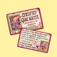 Two illustrated game master cards with purple borders and whimsical fantasy artwork, shown on a pale yellow background. One card reads 'CERTIFIED GAME MASTER' and the other contains rules text about hugging spotlight and giving away puzzle solutions.
